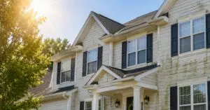 sun and dirty house, concept of Protecting Your Home's Exterior From New Jersey's Extreme Summer Heat